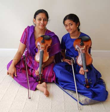 Master Carnatic violinist Anuradha Sridhar (left) and apprentice Sruti Sarathy.