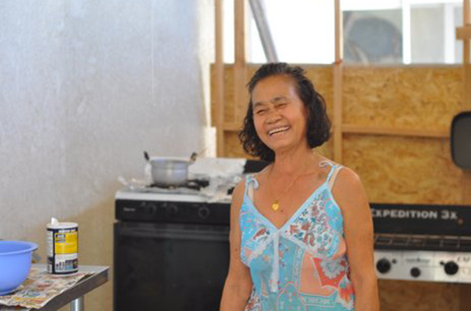 Leanne Mounvongkham in her outdoor kitchen at her home in Fresno, California. Kitchens in Laos are also typically outdoors.