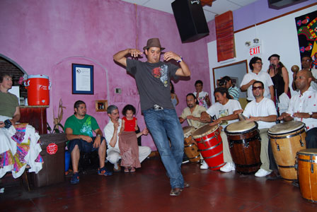 Dancers and drummers at an informal bombazo hosted by Bay Area Boricuas