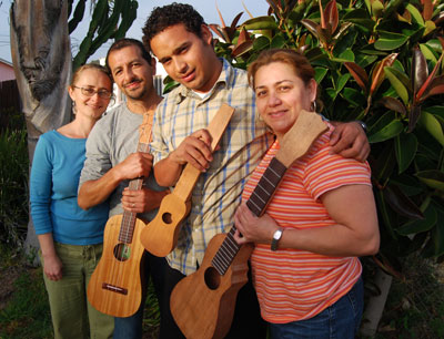 A family affair.  From left, Sonia Kroth, Jorge Mijangos, Juan Francisco Parroquin,  and Patricia Parroquin with some of Mijangos’ guitarras de sones at various stages of completion.