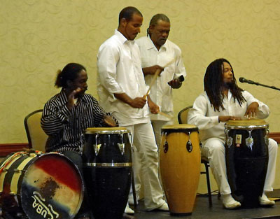 Photo of master Afro-Cuban musician Juan Carlos Blanco Riera with Menelike Turner, Omar Riquelme, and Reynaldo Atesiano Matos