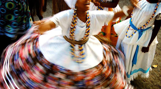 Dancers perform samba de roda, a traditional dance and music genre from Brazil.